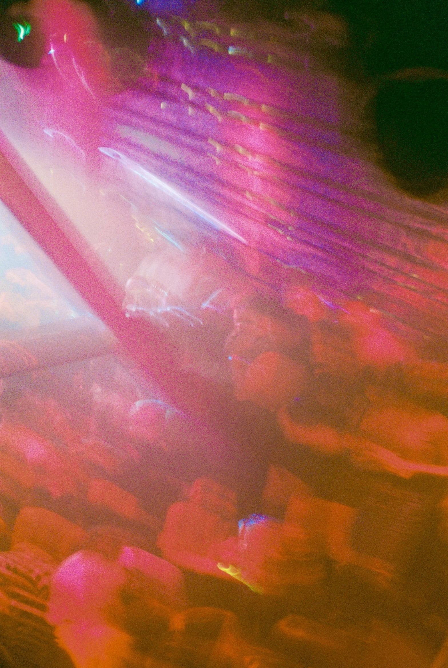 Experimental nightlife portrait with pink and orange motion