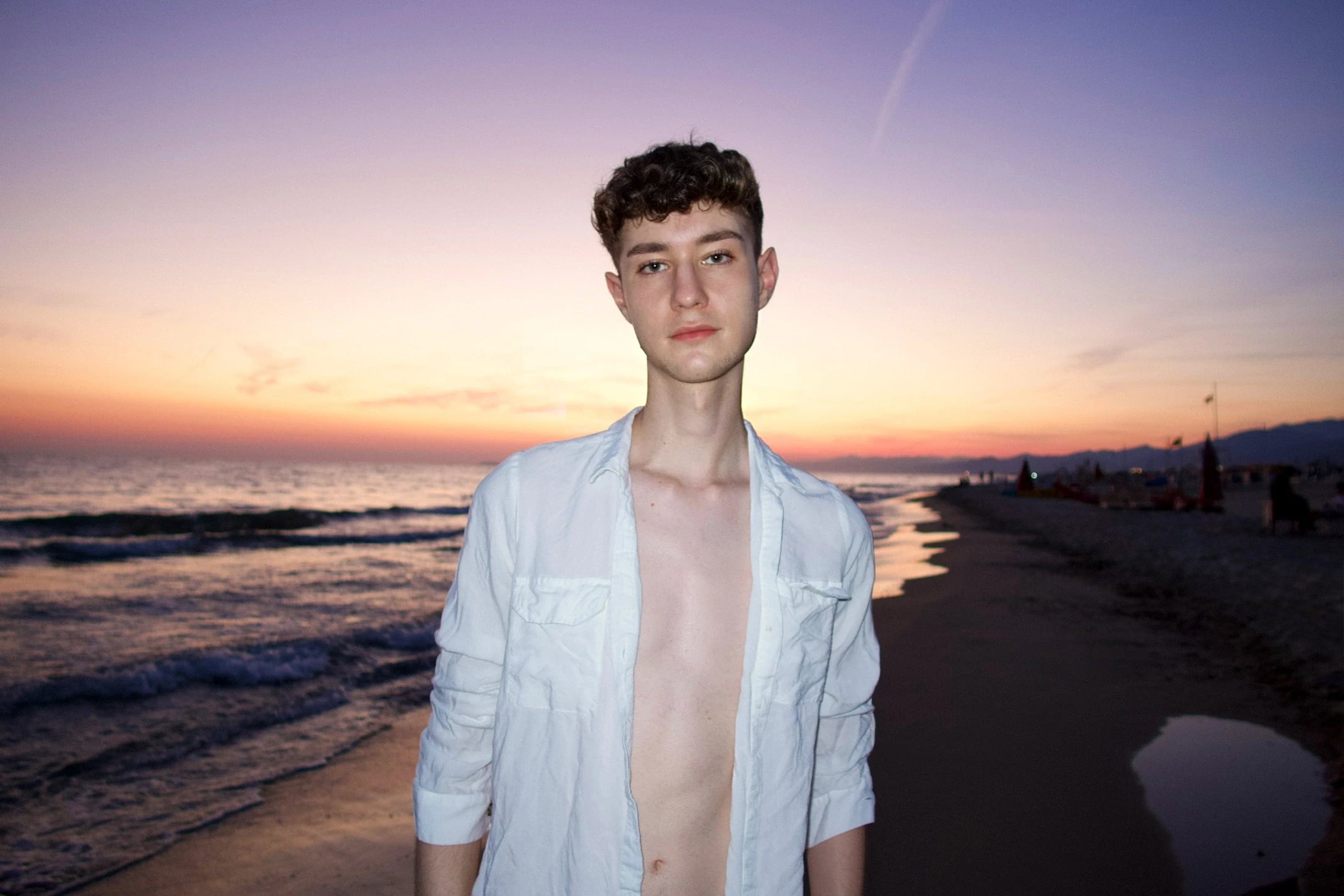 Flash portrait on a beach at sunset